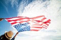 Close up young happy woman holding United States of America flag Royalty Free Stock Photo