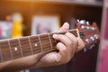 Close up of young hipster woman practiced guitar in the park,happy and enjoy playing guitar Royalty Free Stock Photo