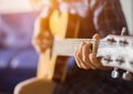 Close up of young hipster woman practiced guitar in the park,happy and enjoy playing guitar Royalty Free Stock Photo