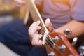 Close up of young hipster woman practiced guitar in the park,happy and enjoy playing guitar Royalty Free Stock Photo