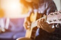 Close up of young hipster woman practiced guitar in the park,happy and enjoy playing guitar Royalty Free Stock Photo