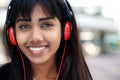 Close up young Indian woman smiling with headphones Royalty Free Stock Photo