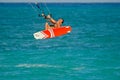 A man jump with kiteboard above the sea