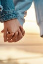 Close up of young lesbian couple holding each other hands, standing together outdoors Royalty Free Stock Photo