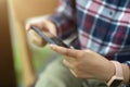 Young male using smartphone, watching video, playing game Royalty Free Stock Photo