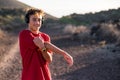 Close up of young man doing exercise outdoors and stretching after workout - runner or jogger training to be healthy and fit Royalty Free Stock Photo