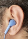 Close up young man ear earphone Royalty Free Stock Photo