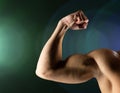 Close up of young man flexing and showing biceps Royalty Free Stock Photo