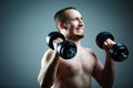 Close up of young man lifting weights Royalty Free Stock Photo