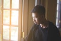 Young man looking out of window Royalty Free Stock Photo