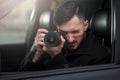 Close-up - Young Man Photorapher Sitting In The Car Royalty Free Stock Photo