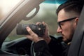 Close-up - Young Man Photorapher Sitting In The Car Royalty Free Stock Photo