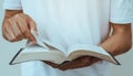 close up young man reading the holy bible Royalty Free Stock Photo