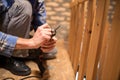 Close-up of a young man replacing drill bits and tightening drill head