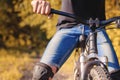 Close-up of a young man`s hand on the wheel of a mountain