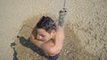 young man showering on beach Royalty Free Stock Photo