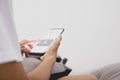 Close-up young man sitting on the bed using smartphone at late night, Phone disease and Nomophobia. Healthy Concept