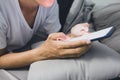 Close-up young man sleepy on the bed using smartphone at late night, Phone disease and Nomophobia. Healthy Concept