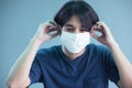 Close up of young man in sterile face mask isolated background. Epidemic pandemic coronavirus 2019  covid-19 flu virus concept Royalty Free Stock Photo