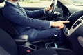 Close up of young man in suit driving car Royalty Free Stock Photo