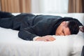 Close-up of a young man in suit sleeping on a bed Royalty Free Stock Photo