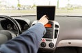 Close up of young man with tablet pc driving car Royalty Free Stock Photo