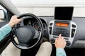 Close up of young man with tablet pc driving car Royalty Free Stock Photo