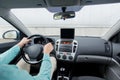 Close up of young man with tablet pc driving car Royalty Free Stock Photo