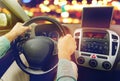 Close up of young man with tablet pc driving car Royalty Free Stock Photo