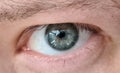 Close up young mans eye, look from under eyelids Royalty Free Stock Photo