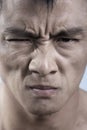 Close up of young mans face, irritated Royalty Free Stock Photo