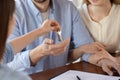 Close up young married couple receiving keys from new house Royalty Free Stock Photo