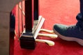 Close up young men feet playing on piano pedals