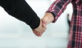 close up. young men firmly shaking hands Royalty Free Stock Photo