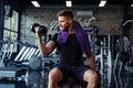 Close Up of a muscular young man lifting weights in gym Royalty Free Stock Photo