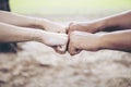 Close up of Young People Smacking Punch Hands Together Royalty Free Stock Photo