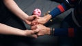 Close up, young person holding wrinkled hand of elderly woman over the broken piggy bank Royalty Free Stock Photo