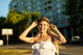 Woman portrait of young pretty trendy girl posing at the city, summer street Royalty Free Stock Photo