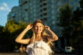 Woman portrait of young pretty trendy girl posing at the city, summer street Royalty Free Stock Photo