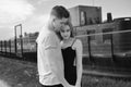 Close-up of young romantic couple is kissing and enjoying the company of each other in black and white. Young couple in love