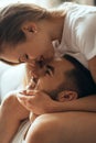 Close-up of young romantic couple is kissing and enjoying the company of each other at home Royalty Free Stock Photo