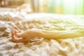 Close up young sick male hand lying in bed while strugle with ilness f Royalty Free Stock Photo