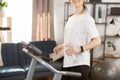 Close up of young skinny strong sporty athletic sportswoman wearing white t-shirt warm up training