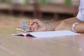 Close up of young student hands writing on notebook Royalty Free Stock Photo