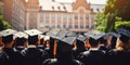 Close up of young students graduating university with graduation caps Royalty Free Stock Photo