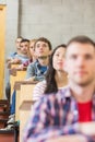 Close up of young students sitting in classroom Royalty Free Stock Photo