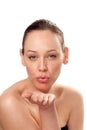 Close up of a young woman blowing a kiss Royalty Free Stock Photo