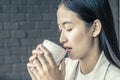 Close up young woman drinking relaxing coffee Royalty Free Stock Photo