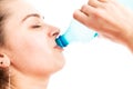 Close-up of young woman drinking water from plastic bottle Royalty Free Stock Photo