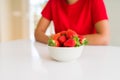 Close up of young woman eating fresh strawberries Royalty Free Stock Photo